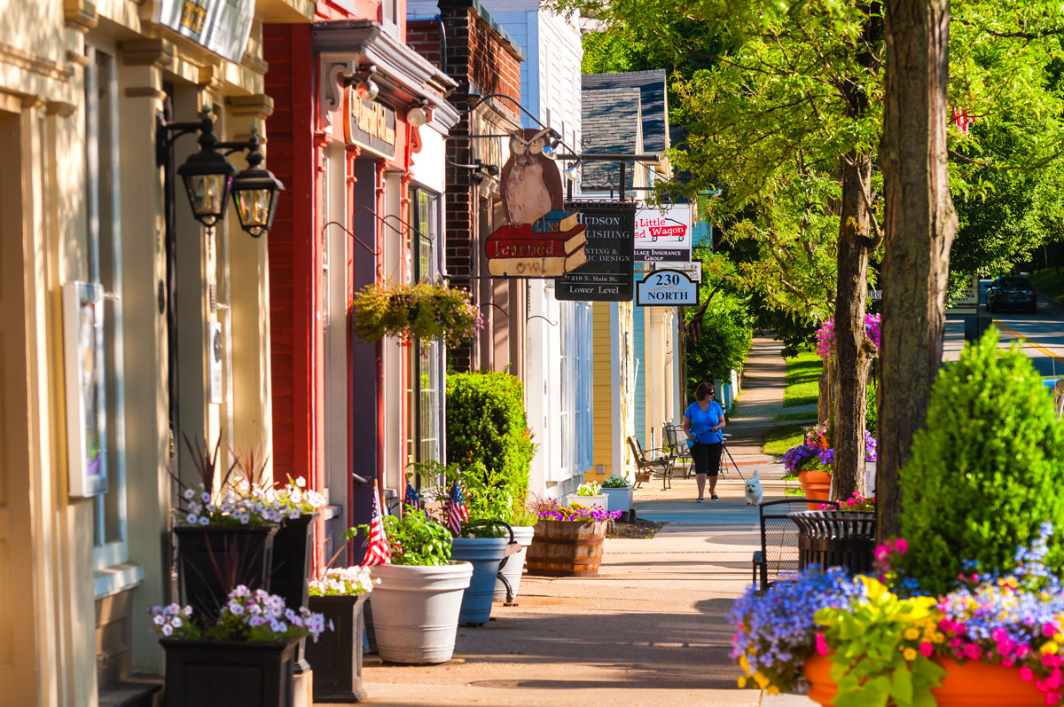 Hudson, OH, USA - June 14, 2014: Quaint shops and businesses dating back more than a century line Hudson's Main Street looking north.